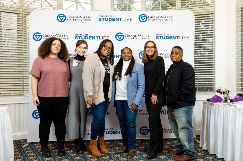 Another photo of panelist taking a selfie together